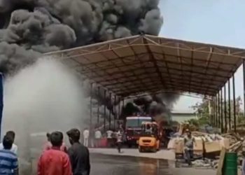 Fire officials trying to douse the fire at the scrapyard in Duvvada, Visakhapatnam