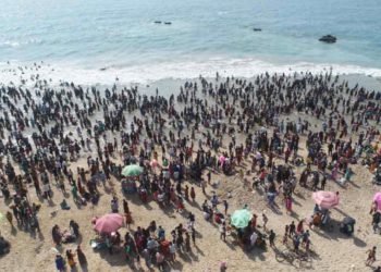 Crowds flock to Vizag beach to take a holy dip post Maha Shivarathri