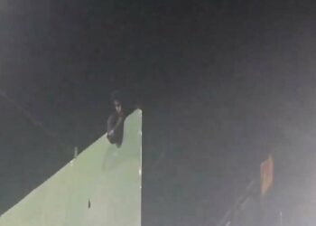 Vizag: Young man climbs hoarding and threatens suicide, rescued after 4 hours