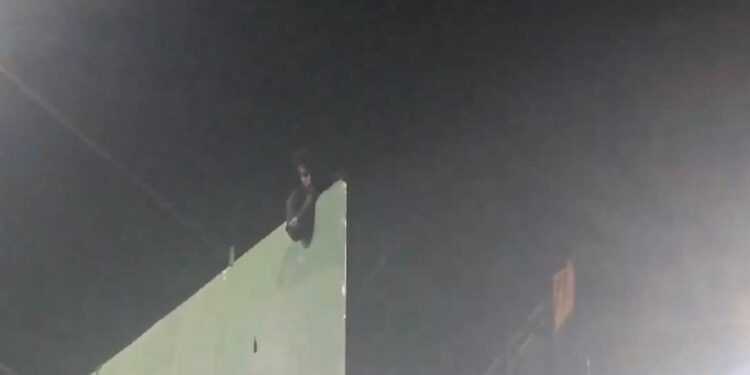 Vizag: Young man climbs hoarding and threatens suicide, rescued after 4 hours