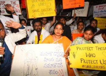 Home Minister Vangalapudi Anitha stands with doctors at protest in Visakhapatnam